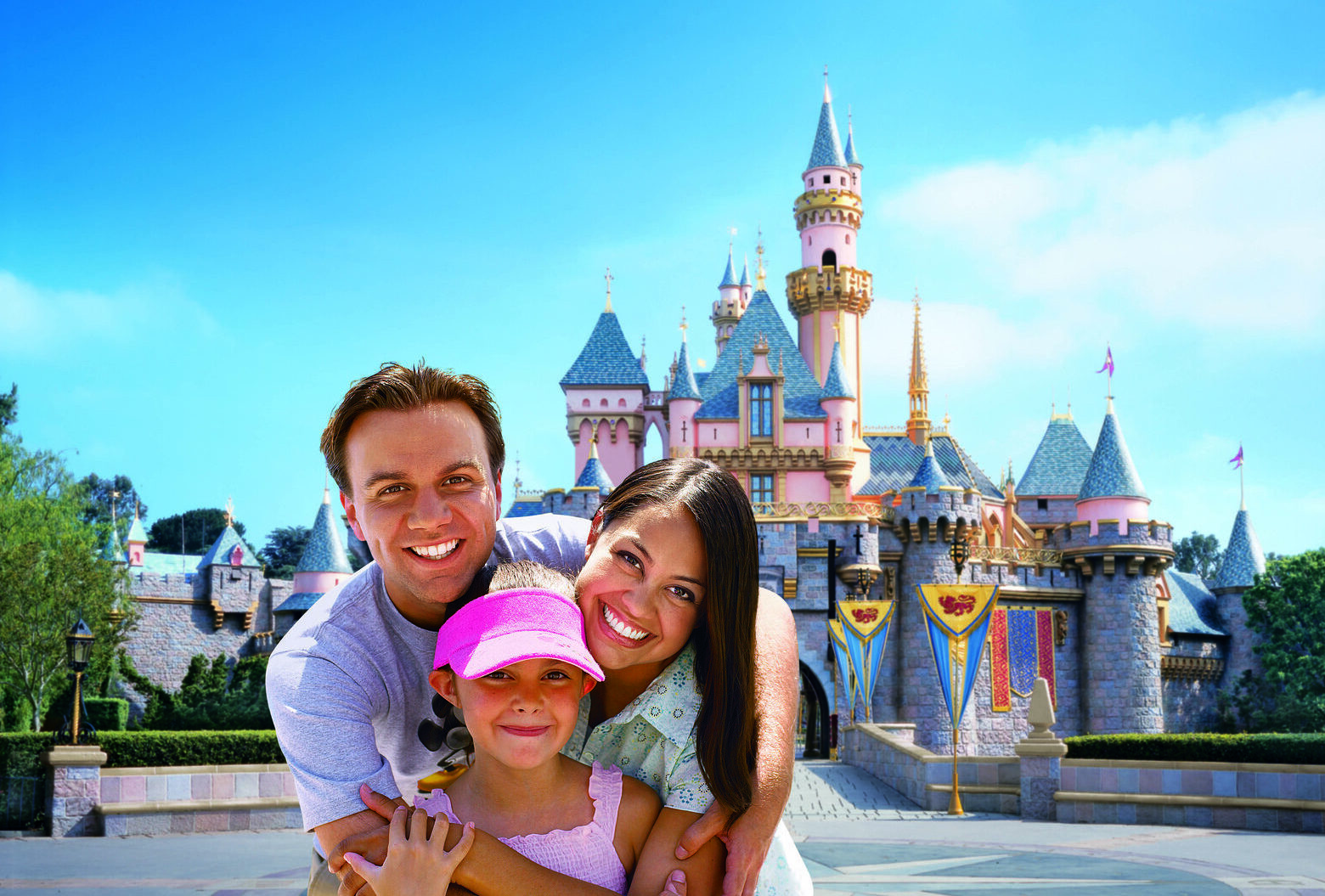 Illustration for Disneyland Planning — a smiling family of three hugging in front of Sleeping Beauty Castle, with their young daughter in the middle.