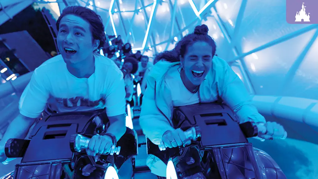 People having fun riding Tron rollercoaster