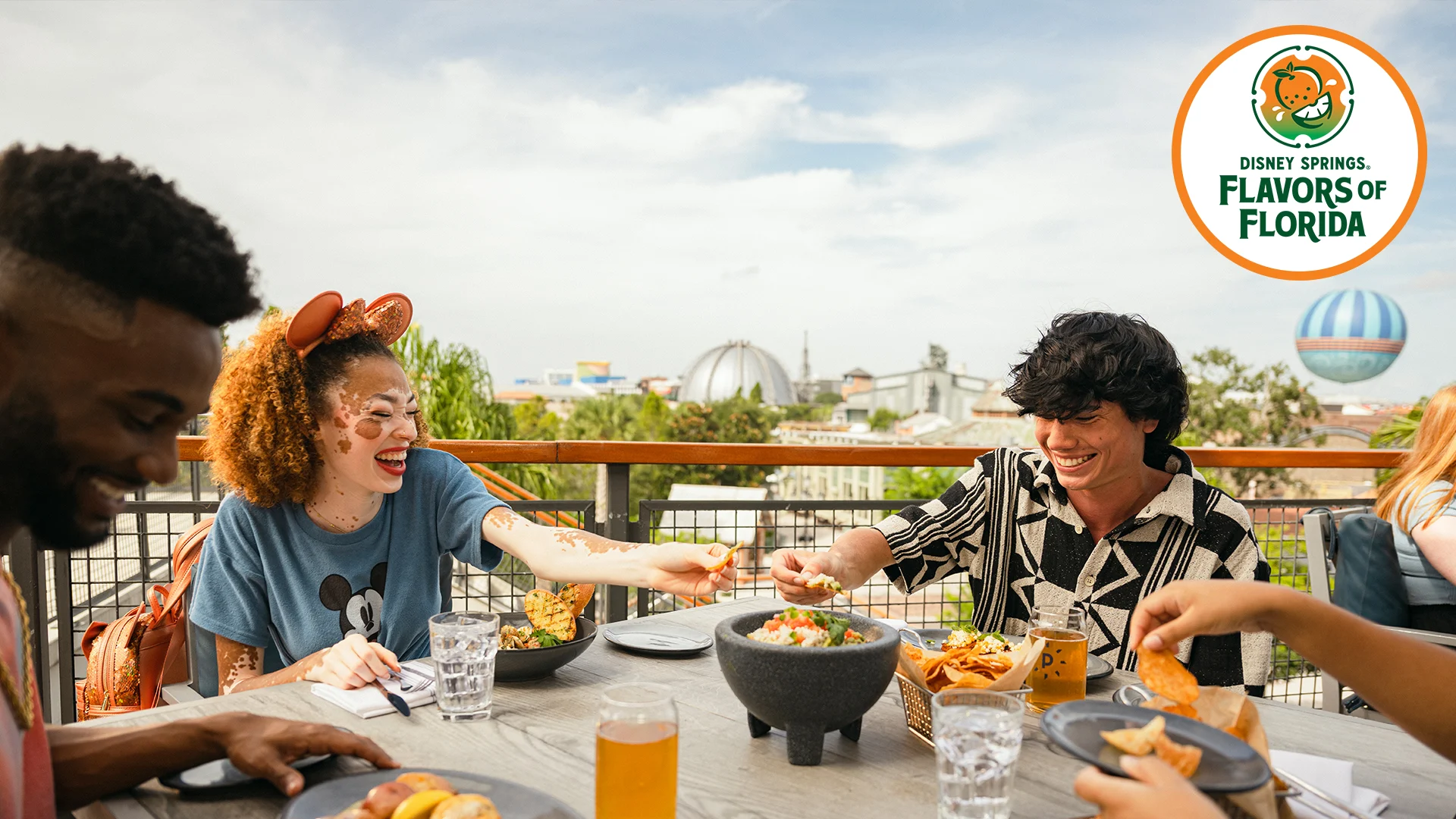 Family eating chips and salsa at Disney Springs