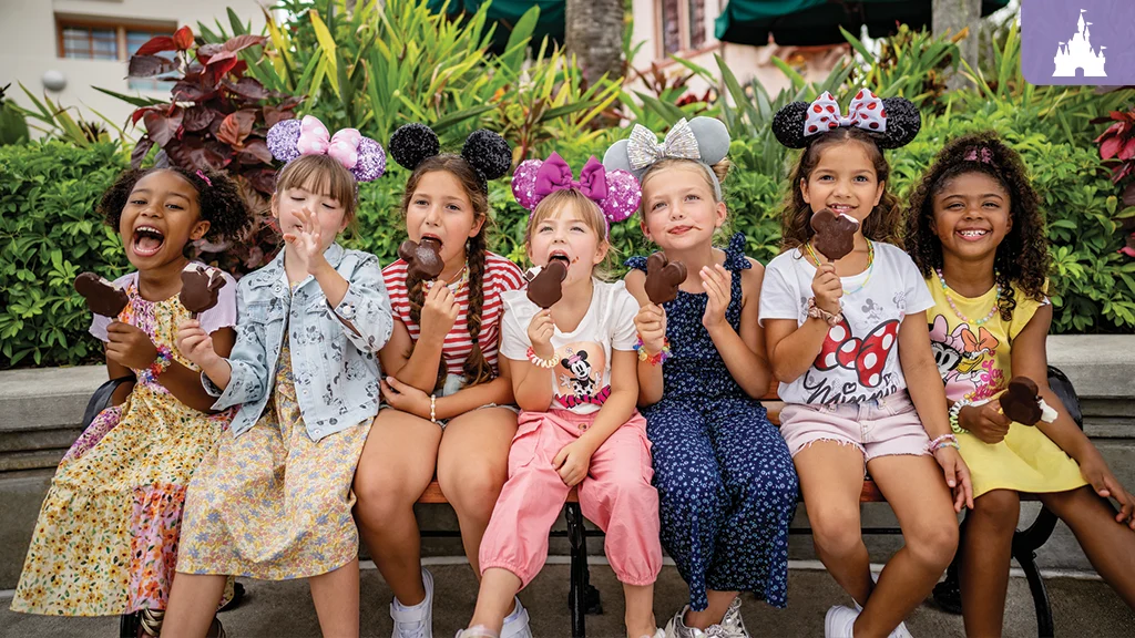kids eating Mickey ice cream wearing minnie ears