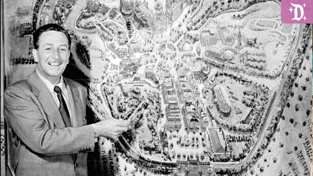 Black and White Photo of Walt Disney pointing to a map of Disneyland