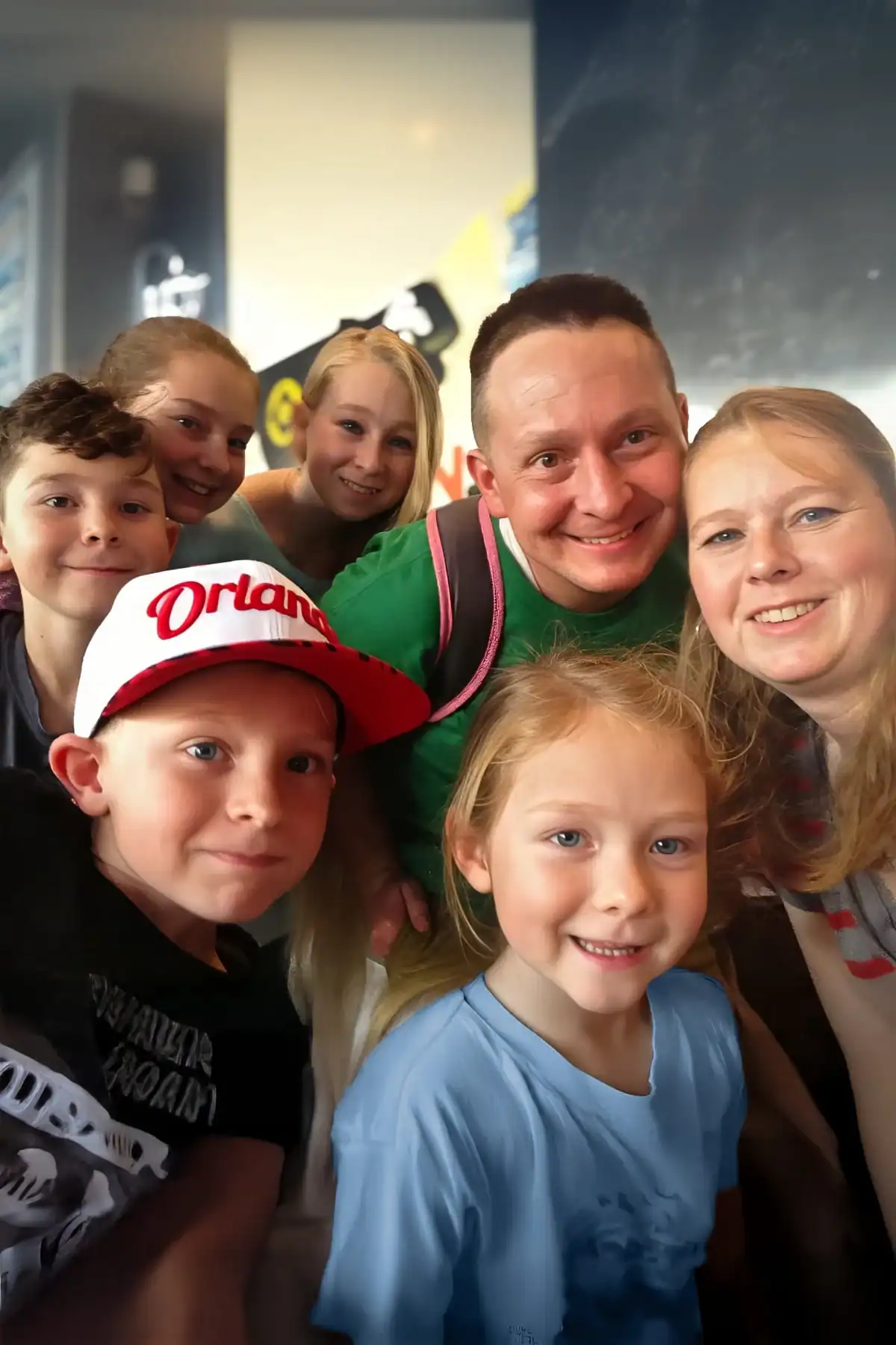 A family poses for a photo together.